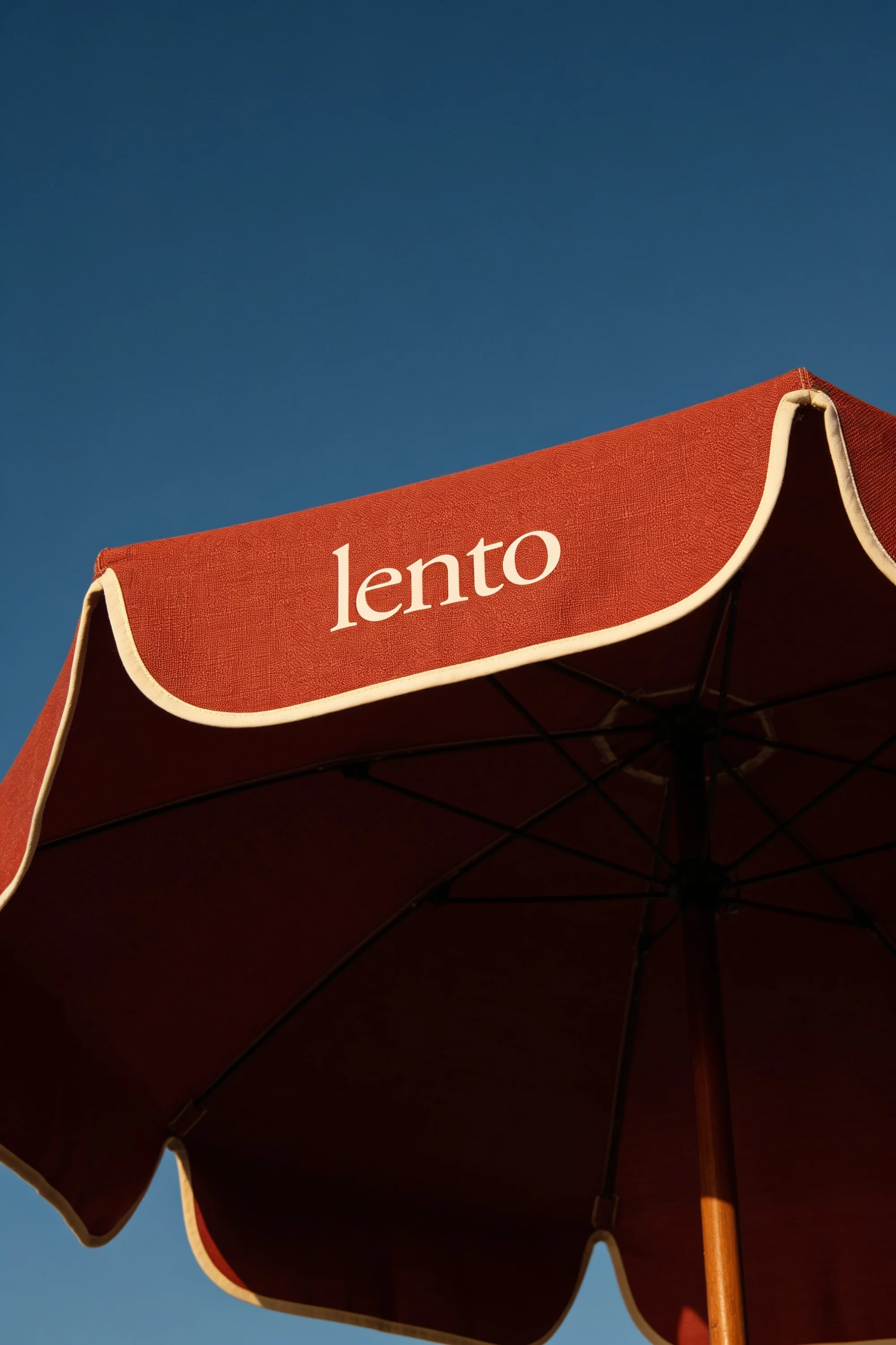 Floating deck with loungers and branded parasol — Hospitality Design by Parallel Creative Agency — Lento, hospitality