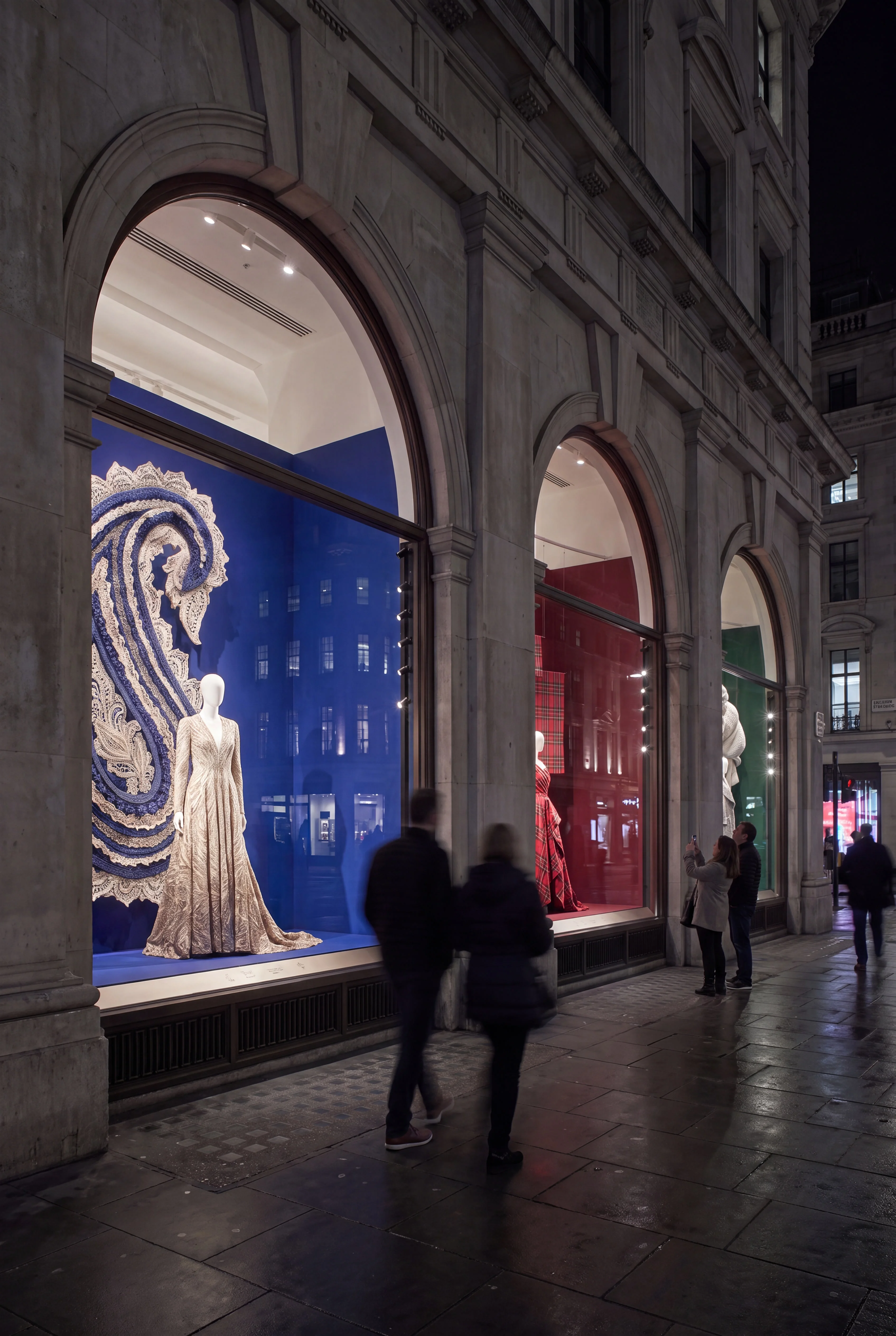 Night-time view along the arched windows of the Loom textile exhibition — Window Concept by Parallel Creative Agency — Loom, culture