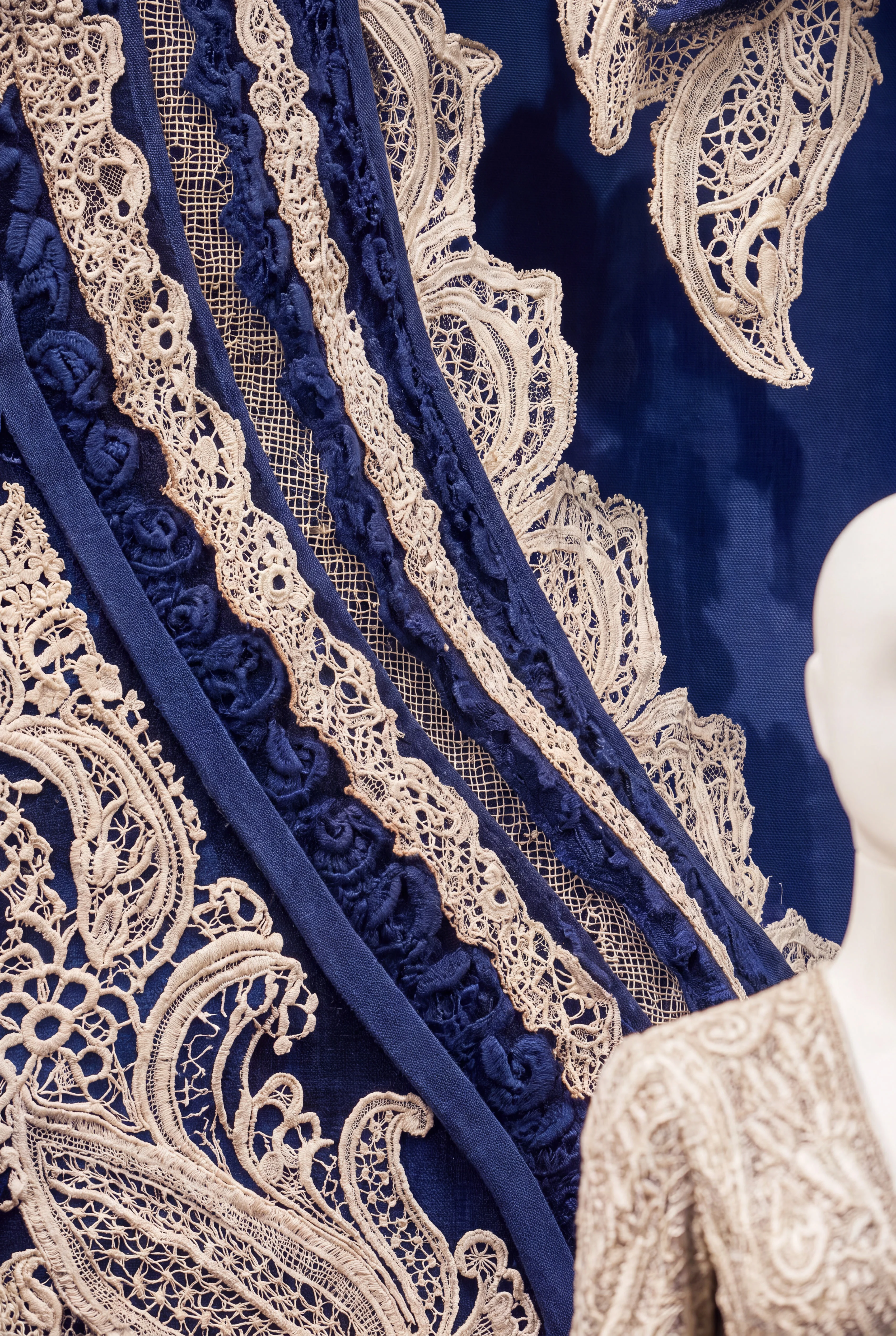 Close-up of layered blue and cream lace forming an oversized Paisley pattern — Window Concept by Parallel Creative Agency — Loom, fashion