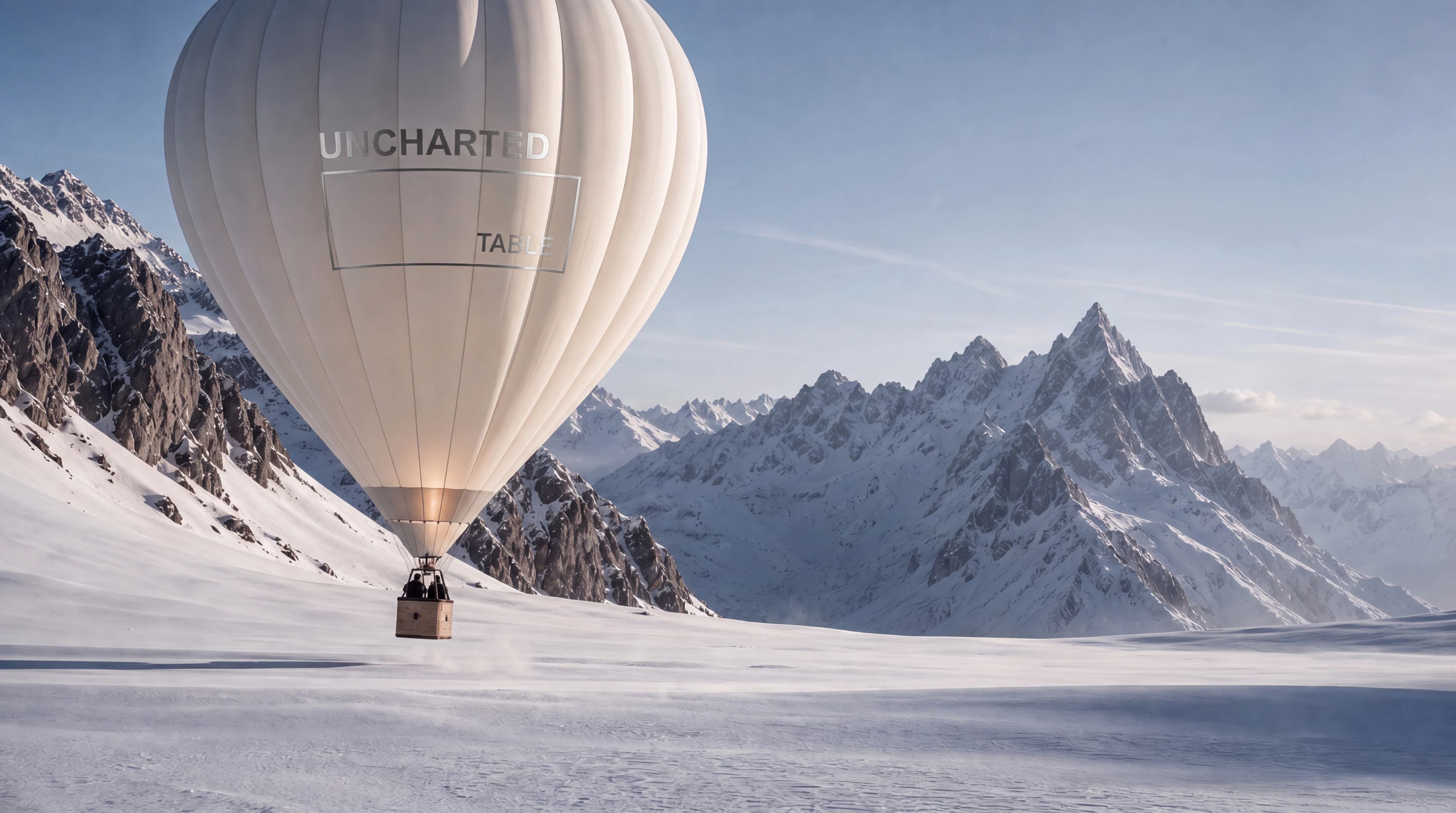 Branded hot-air balloon standing on a remote glacier beneath jagged mountain peaks — Brand Design by Parallel Creative Agency — Uncharted Table, hospitality and travel